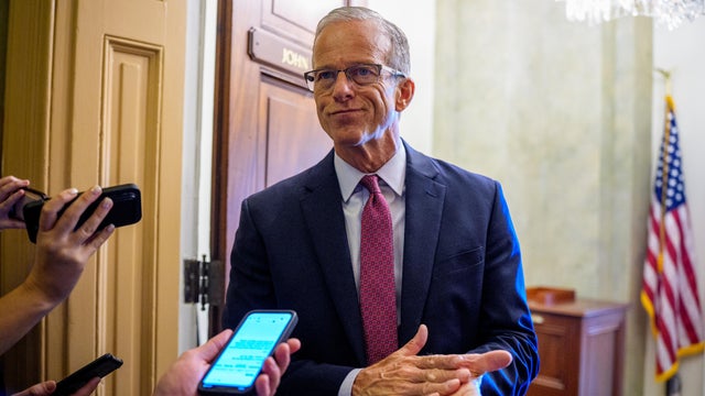 Senate Majority Leader John Thune takes a question from a reporter outside his office at the U.S. Capitol Building on September 18, 2025 in Washington, D.C. 