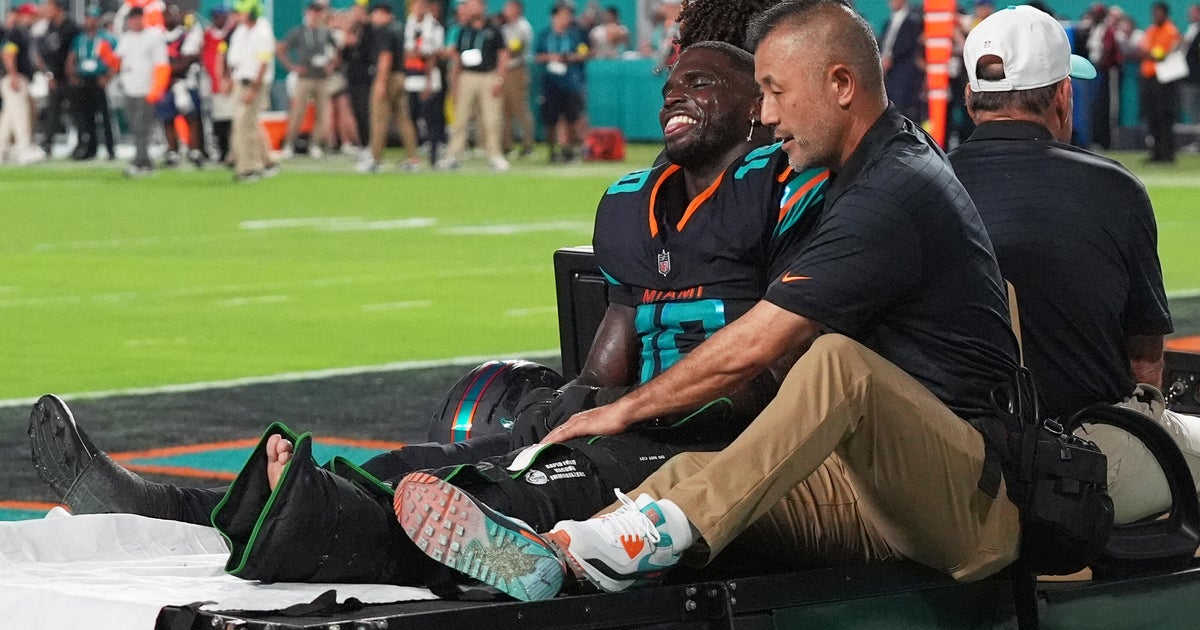 Dolphins star receiver Tyreek Hill taken to hospital with dislocated left knee. How long will he be sidelined?