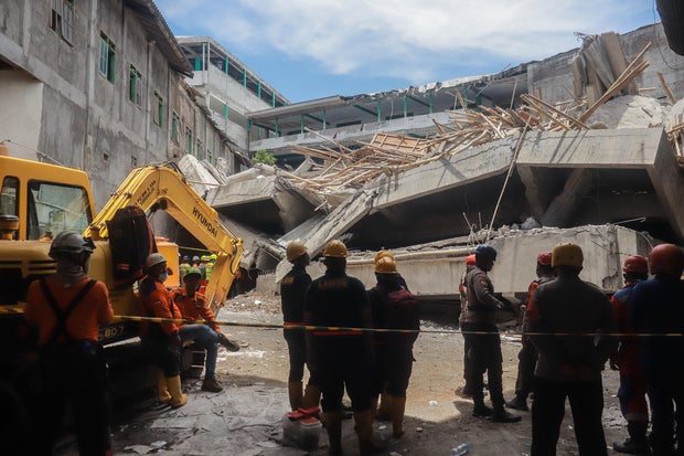 Search and rescue operations ongoing after school building collapse in Indonesia 