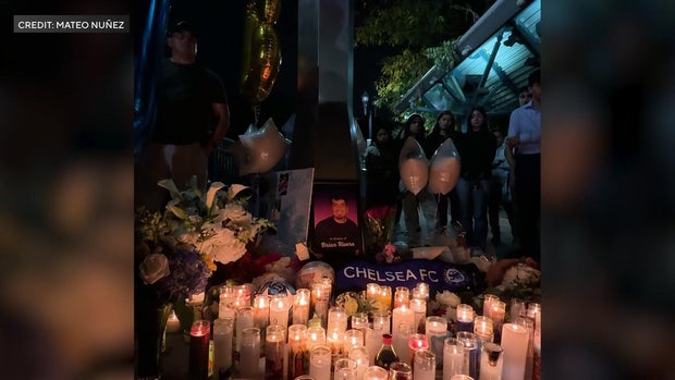 Candles and flowers at a vigil for Brian Rivera 