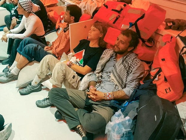 Swedish activist Greta Thonberg and Brazilian activist Thiago Avila sitting in a ship with members of Somoud Sumoud, and set their way to Israel 