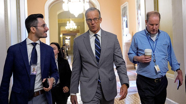 Senate Majority Leader John Thune of South Dakota speaks with reporters as he walks onto the Senate floor at the U.S. Capitol in Washington, D.C., on Oct. 8, 2025, during the ongoing government shutdown. 