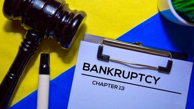 Bankcrupty Chapter 13 text on Document form and Gavel isolated on office desk. 