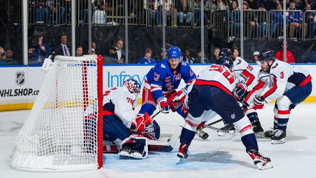 Charlie Lindgren #79 of the Washington Capitals makes a save against Adam Fox #23 of the New York Rangers at Madison Square Garden on October 12, 2025 in New York City. 