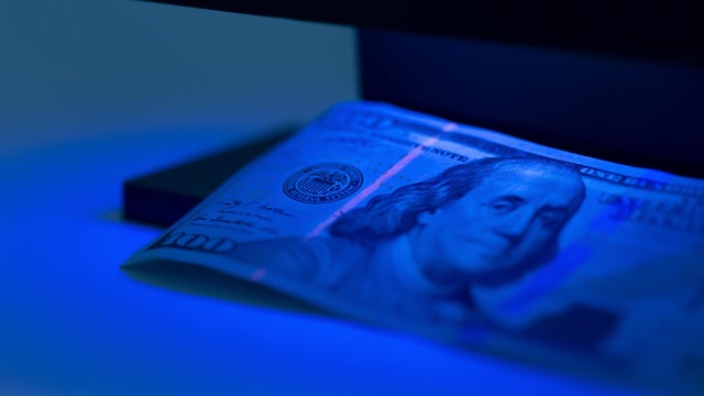 checking money close up 