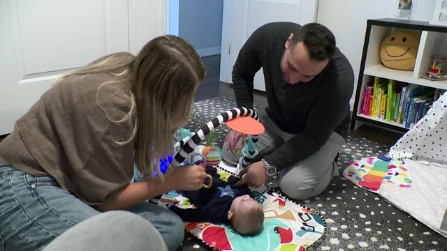A Long Island couple with their 3-month-old child 
