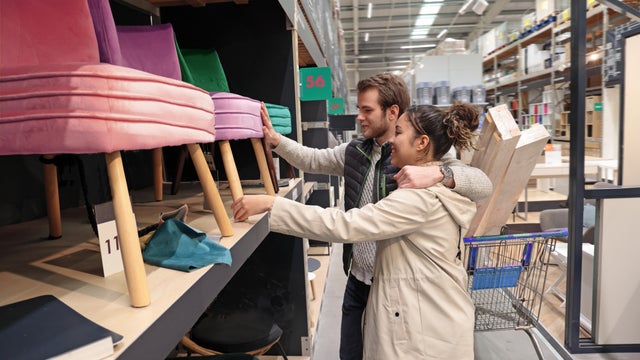 Mixed race couple choosing furniture 