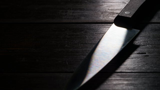Kitchen knife on dark background 