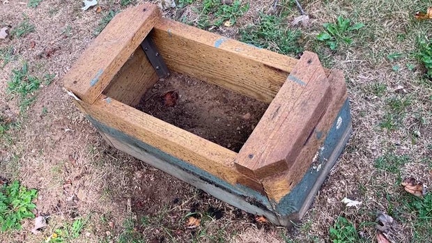 Wooden stubs where headstones used to be