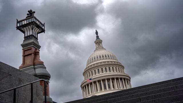 The Capitol is seen under gray skies on the thirteenth day of the government shutdown, in Washington, Monday, Oct. 13, 2025. 