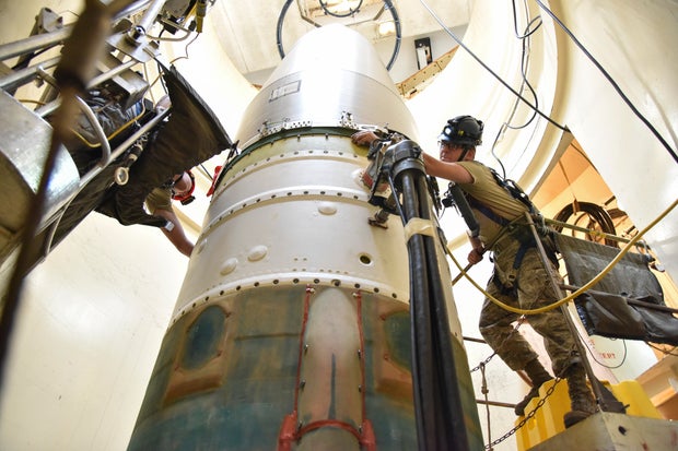 In this image provided by the U.S. Air Force, 341st Missile Maintenance Squadron technicians work on an intercontinental ballistic missile during a test on Sept. 22, 2020, at a launch facility near Malmstrom Air Force Base in Great Falls, Montana.