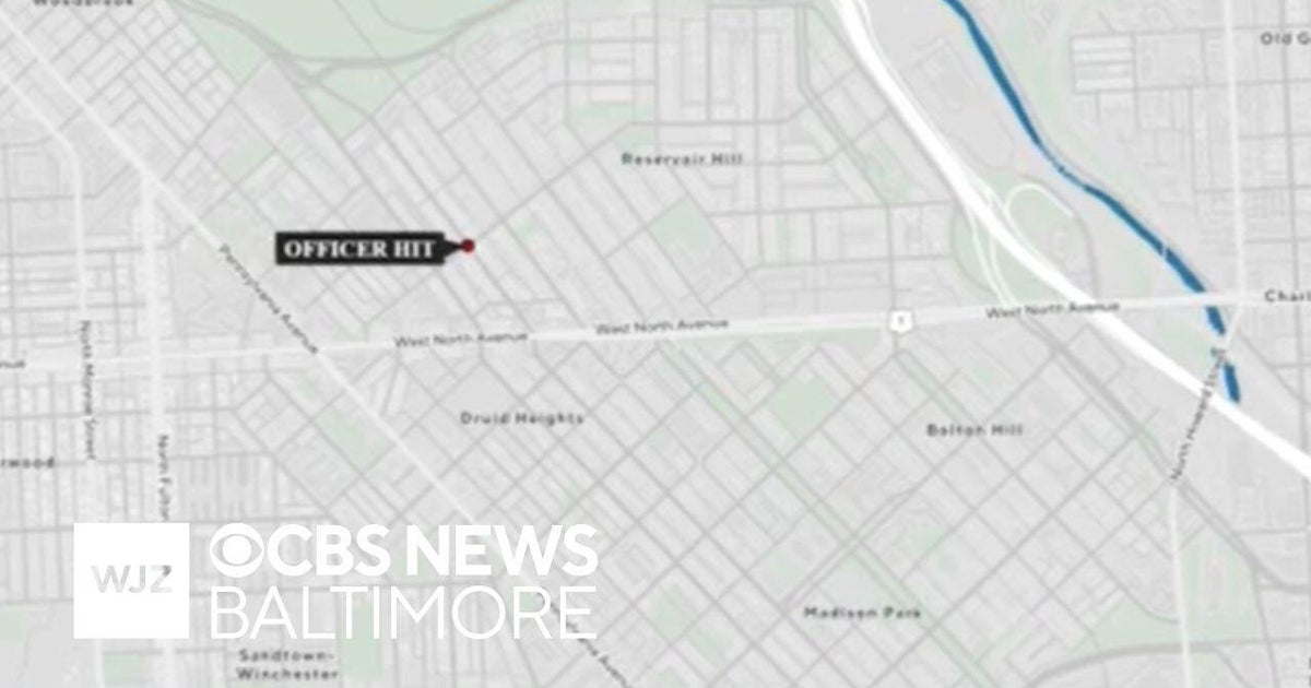 Baltimore police officer hospitalized after being struck by a car - CBS ...