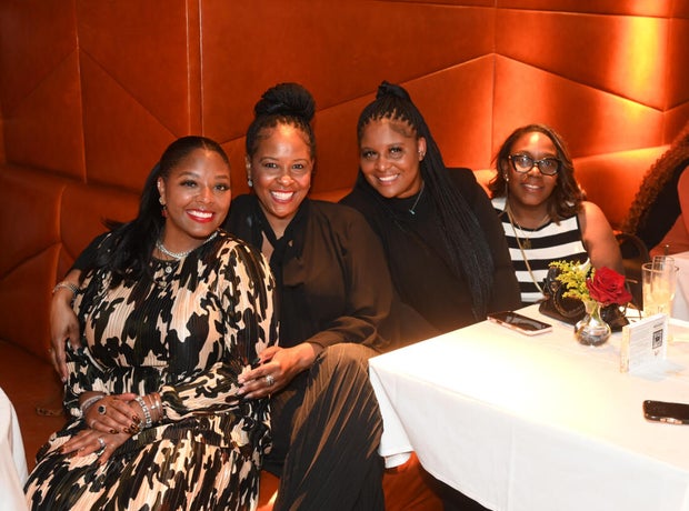 People post for a photo at the opening of Kitchen + Kocktails, a restaurant in Philadelphia
