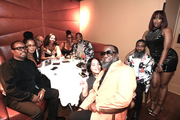 People post for a photo at the opening of Kitchen + Kocktails, a restaurant in Philadelphia