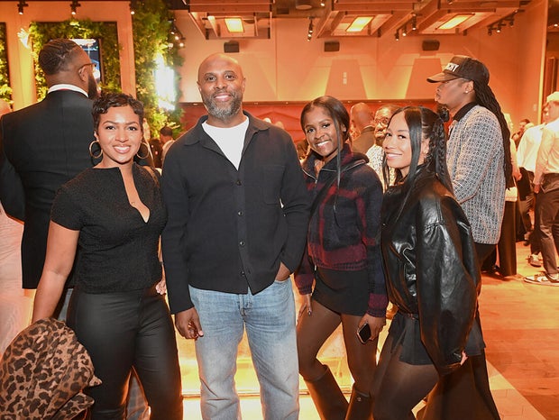 People post for a photo at the opening of Kitchen + Kocktails, a restaurant in Philadelphia