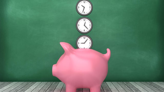 Piggy Bank with Clocks on Chalkboard Background - 3D Rendering 