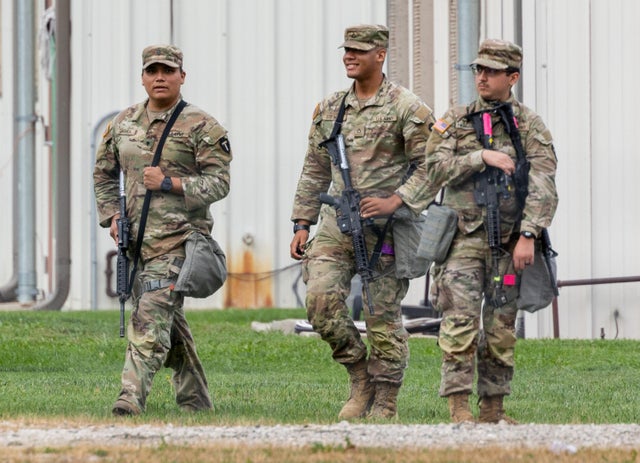 Members of the Texas National Guard walk around the Army Reserve Training Center in Elwood, Illinois, Oct. 7. 2025.
