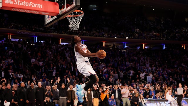 OG Anunoby #8 of the New York Knicks dunks against the Cleveland Cavaliers during their game at Madison Square Garden on October 22, 2025 in New York City. 