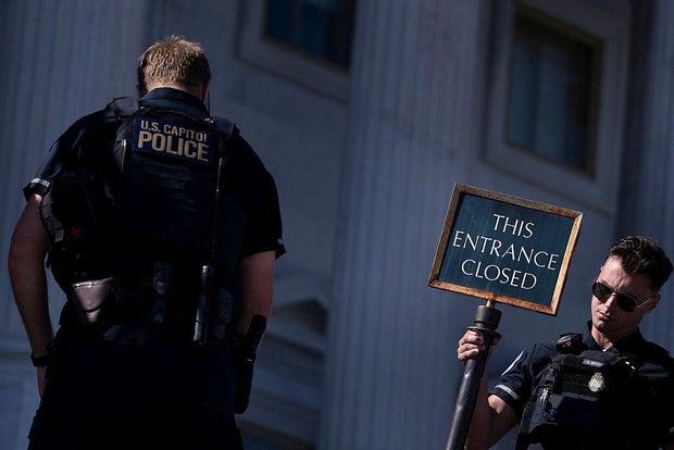 U.S. Capitol Police close an entrance to the Capitol in Washington, D.C., on Oct. 9, 2025. 