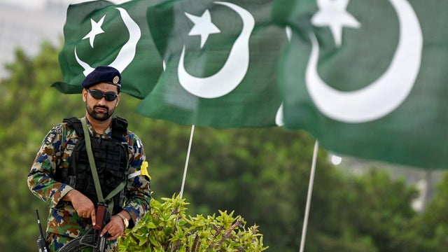 A Uqaab Force commando and air force service member stands guard outside the mausoleum of Pakistan's founding father Muhammad Ali Jinnah in Karachi on Sept. 6, 2025, during celebrations to mark the country's Defence Day. 