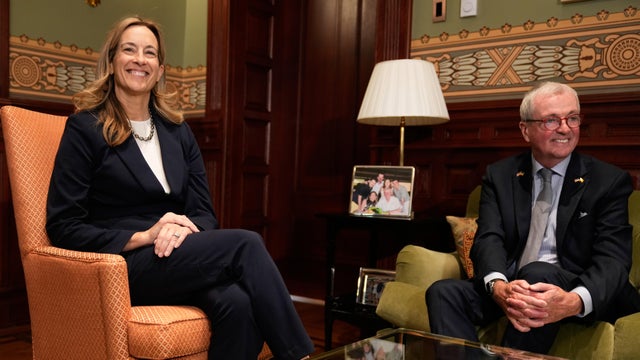 Mikie Sherrill and Phil Murphy smile for a photo 