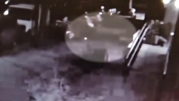 What appears to be a lit cigarette on a sidewalk in the Bronx