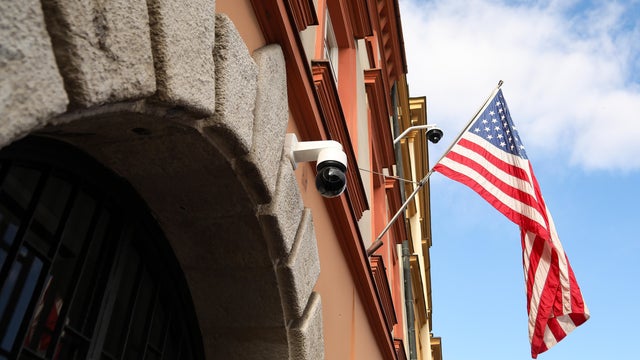 A flag flies outside the U.S. Consulate 