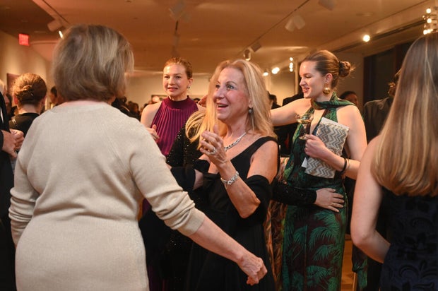 People pose for a photo at the 27th Annual Bacchanal Wine Gala and Auction 