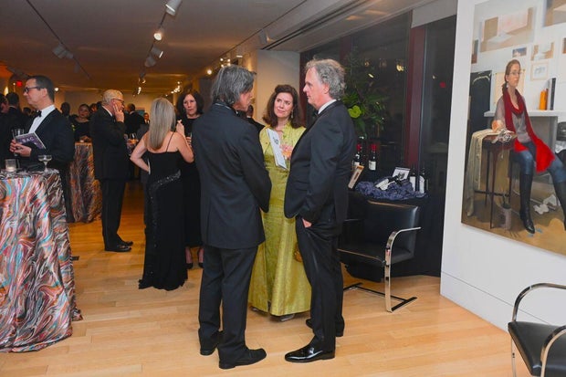 People pose for a photo at the 27th Annual Bacchanal Wine Gala and Auction 