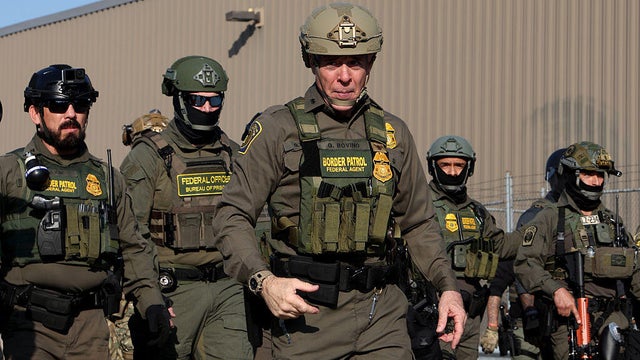 U.S. Border Patrol Chief Gregory Bovino, center, leads federal agents toward protesters near the U.S. Immigration and Customs Enforcement holding facility in Broadview, Illinois, on Oct. 3, 2025. 