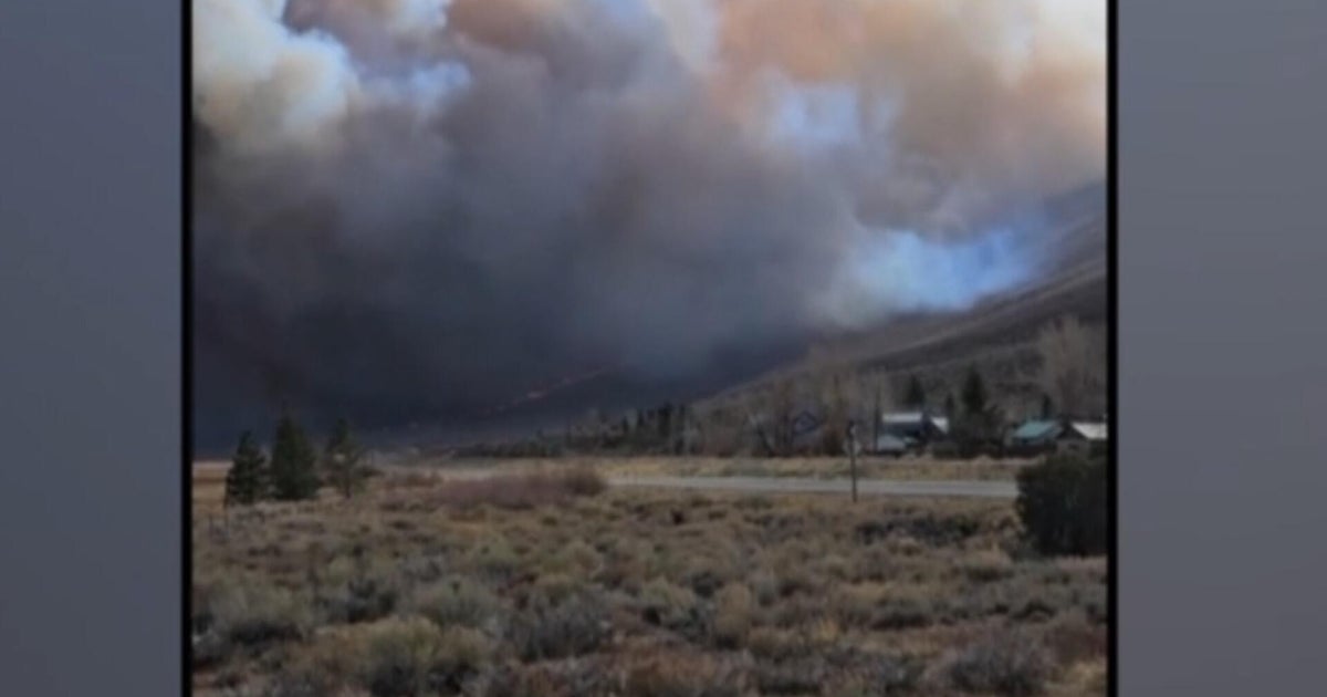 California wildfire forces evacuations and storms trigger mudslides concerns
