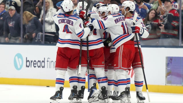 J.T. Miller #8 of the New York Rangers is congratulated by his teammates after scoring the game winning goal during the shootout in the game against the Columbus Blue Jackets at Nationwide Arena on November 15, 2025 in Columbus, Ohio. 