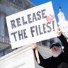 Bill Christeson holds a sign referencing the Jeffrey Epstein files outside the U.S. Capitol in Washington, D.C., on Nov. 12, 2025. 