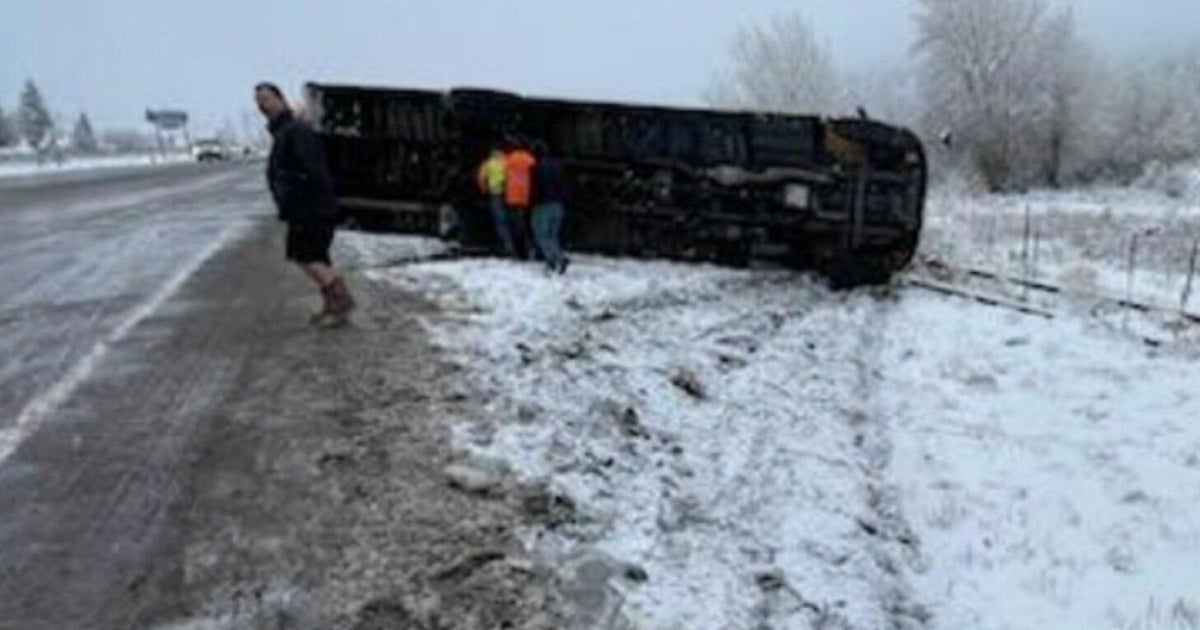 Colorado school bus with 13 students on board overturns on snow-covered ...