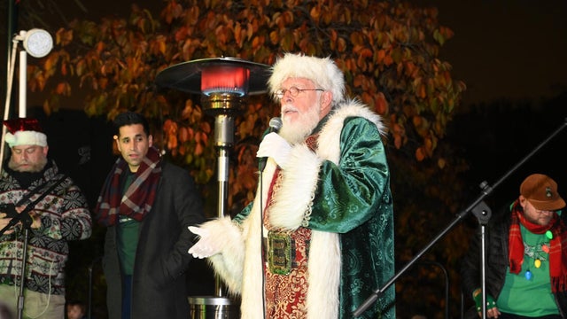 People pose for photos during a holiday event in Manayunk 