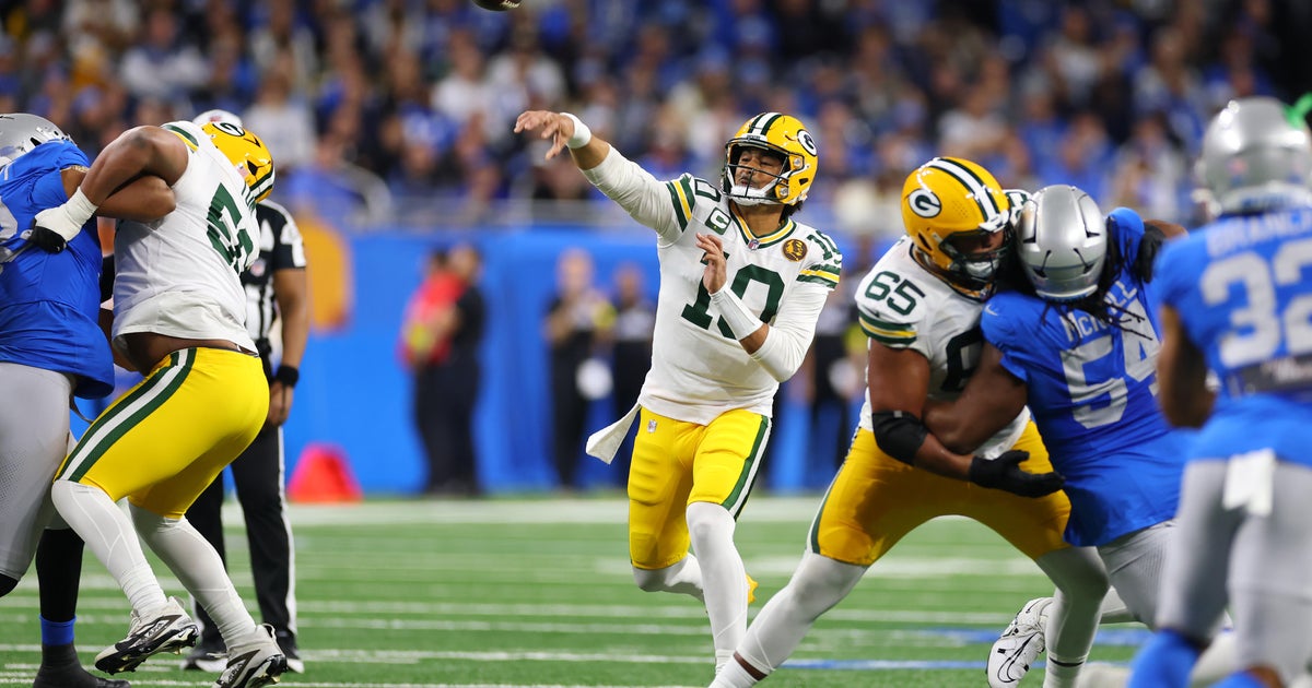 Love matches career high with 4 TD passes, lifting Packers to win over Lions