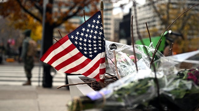 A makeshift memorial has been set up in honor of the two National Guard members who were shot near the Farragut West Metro Station in Washington, D.C., Nov. 27, 2025. 