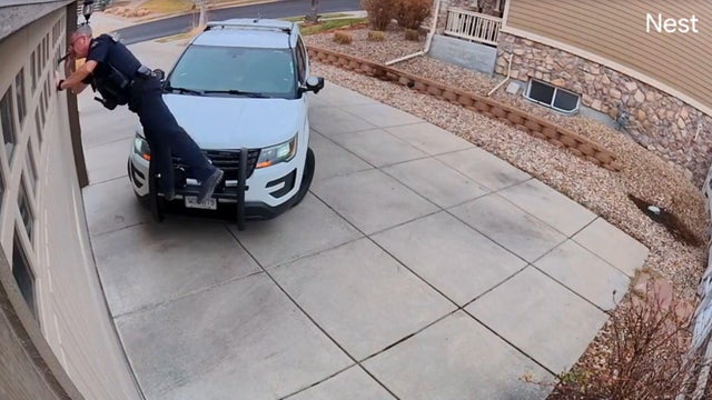 Officer John O'Hayre looking in garage 