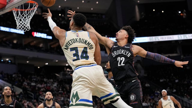 Giannis Antetokounmpo #34 of the Milwaukee Bucks shoots the ball against Jalen Wilson #22 of the Brooklyn Nets during the second quarter at Fiserv Forum on November 29, 2025 in Milwaukee, Wisconsin. 