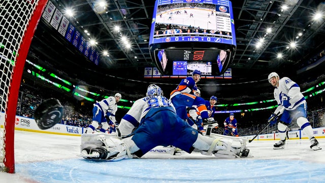 Bo Horvat #14 of the New York Islanders scores a goal past Andrei Vasilevskiy #88 of the Tampa Bay Lightning during the first period at UBS Arena on December 02, 2025 in Elmont, New York. 