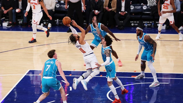 Jalen Brunson #11 of the New York Knicks shoots against LaMelo Ball #1 of the Charlotte Hornets during their game at Madison Square Garden on December 03, 2025 in New York City. 