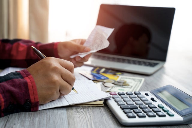 Men and documents that calculate home office expenses 