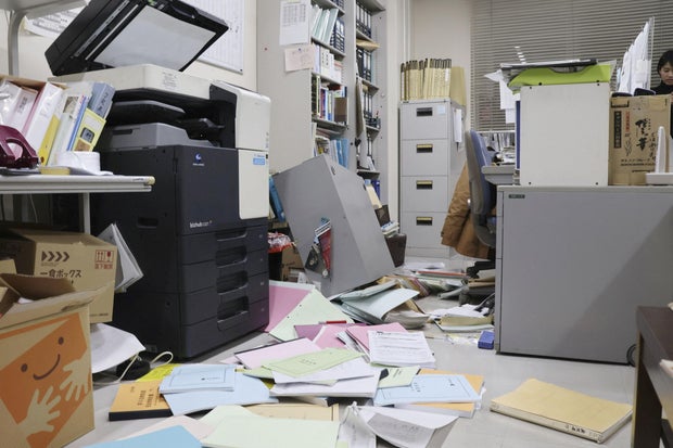 Bookshelves and documents that fell during an earthquake are seen at Kyodo News' Hakodate bureau in Hakodate, Hokkaido, Japan, Dec. 8, 2025, in this photo taken by Kyodo. 