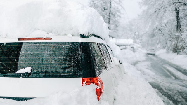 Car buried under deep snow after heavy snowfall 