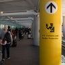 A passenger walks toward immigration control under a U.S. Customs and Border Protection sign at Newark Liberty International Airport in November 2024. 