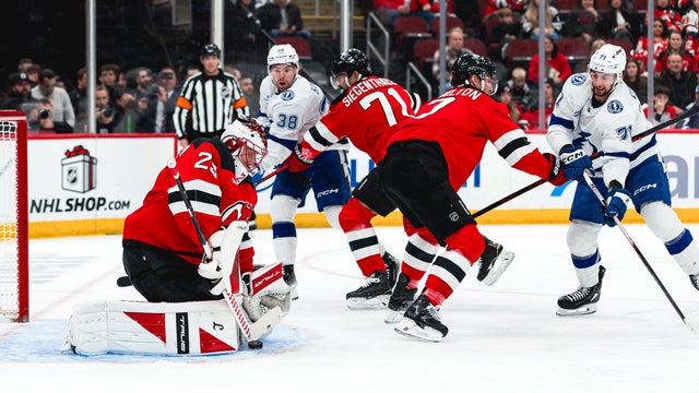 Jacob Markstrom #25 of the New Jersey Devils makes a save during the first period of the NHL regular season game against the Tampa Bay Lightning at the Prudential Center on December 11, 2025 in Newark, New Jersey. 