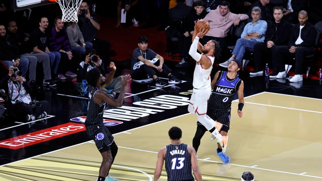 Jalen Brunson #11 of the New York Knicks shoots between Jonathan Isaac #1 of the Orlando Magic and Anthony Black #0 of the Orlando Magic in the first quarter of a semifinal game of the Emirates NBA Cup at T-Mobile Arena on December 13, 2025 in Las Vegas, Nevada. 