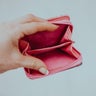 woman hand holding empty wallet 