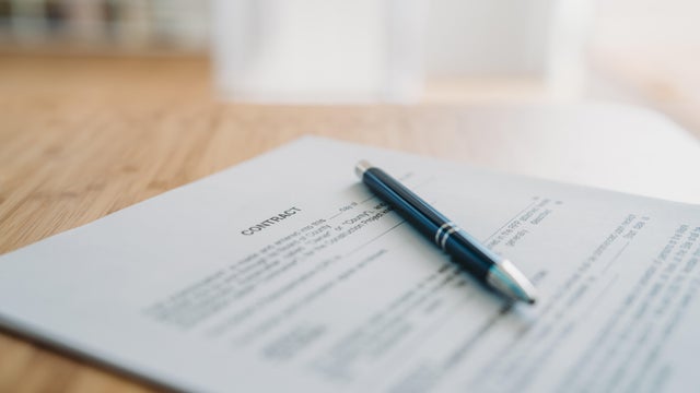 Contract on the desk with a pen 