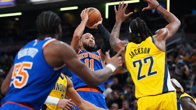 Jalen Brunson #11 of the New York Knicks attempts a shot while being guarded by Isaiah Jackson #22 of the Indiana Pacers in the first quarter at Gainbridge Fieldhouse on December 18, 2025 in Indianapolis, Indiana. 
